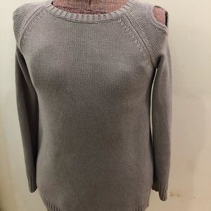 Off the shoulder grey sweater.